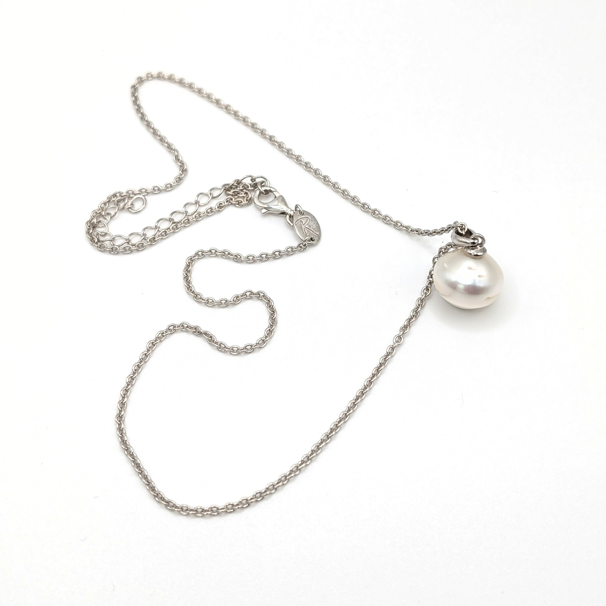 South sea pearl pendant necklace with rhodium plated chain on a white background