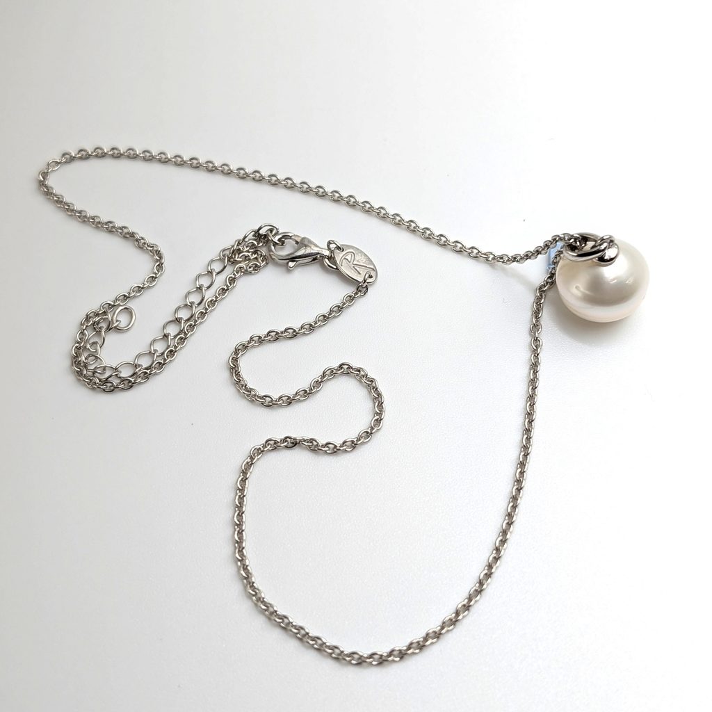 South sea pearl pendant necklace with rhodium plated chain on a white background