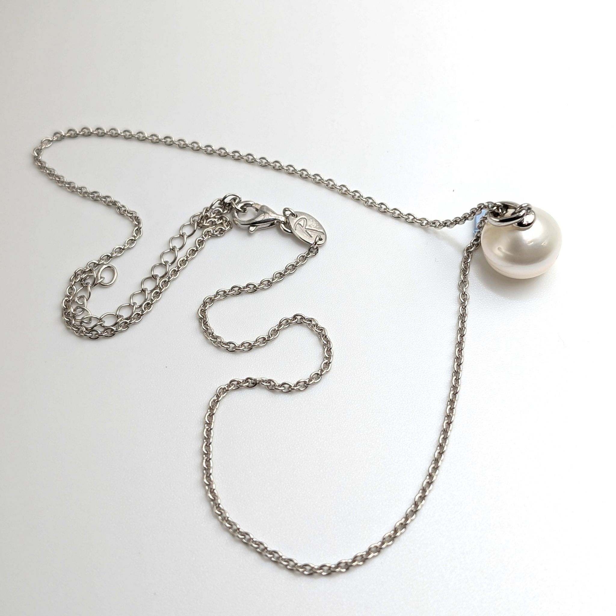 South sea pearl pendant necklace with rhodium plated chain on a white background