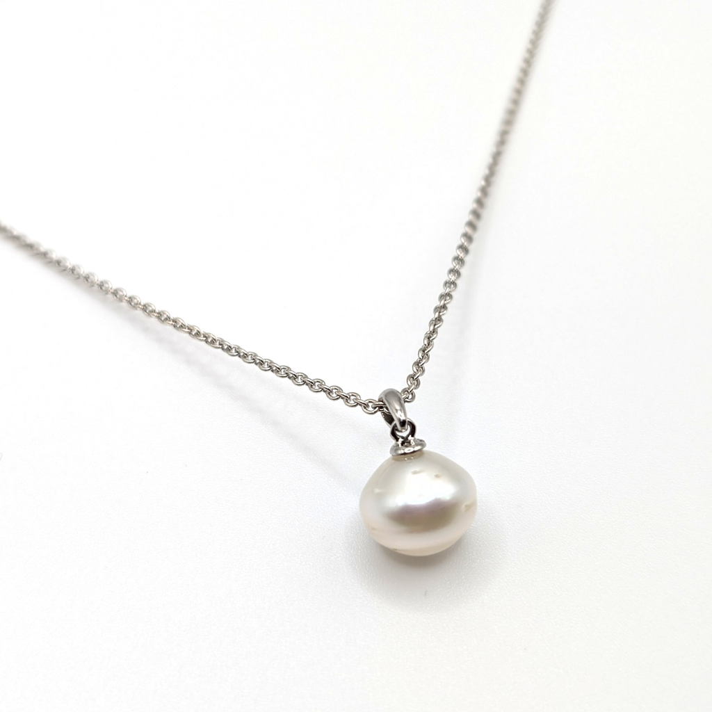 South sea pearl pendant necklace with rhodium plated chain on a white background