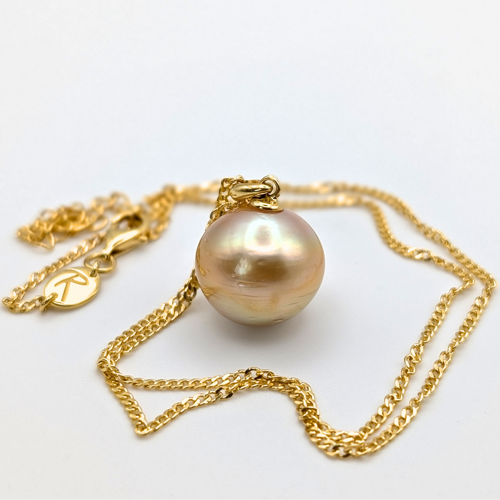 Gold vermeil necklace with an extra large south sea pearl pendant on a white background
