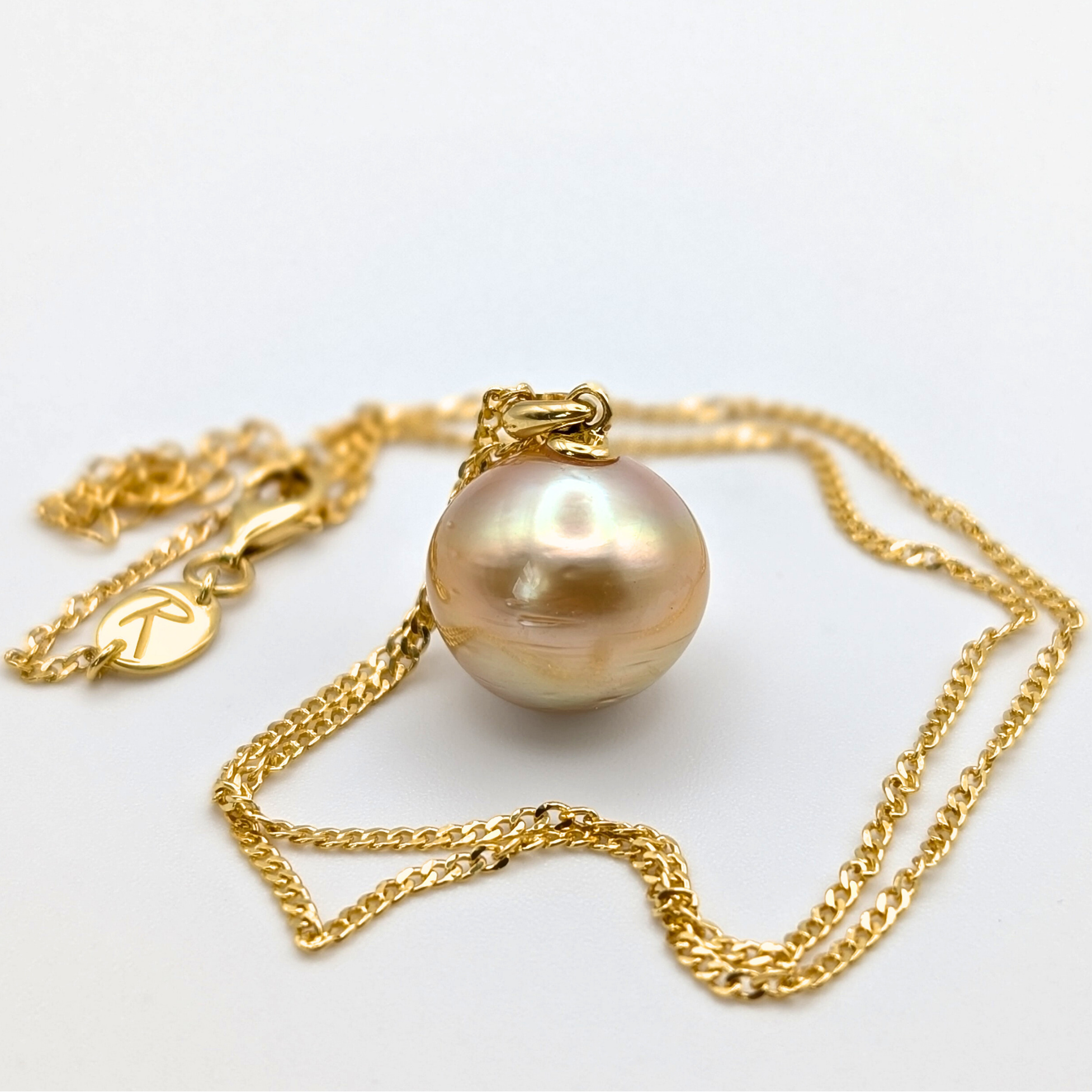 Gold vermeil necklace with an extra large south sea pearl pendant on a white background