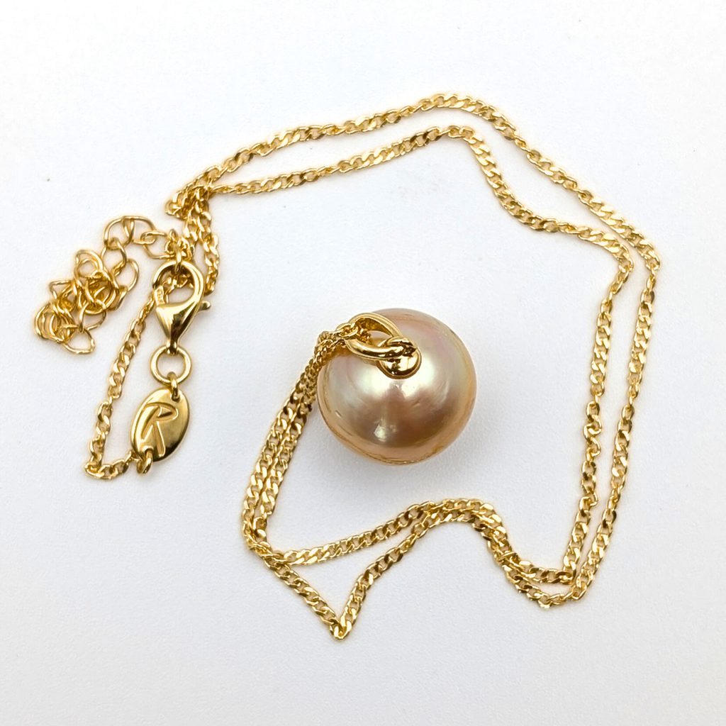 Gold vermeil necklace with an extra large south sea pearl pendant on a white background