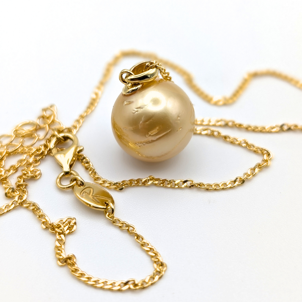 Gold vermeil necklace with an extra large south sea pearl pendant on a white background