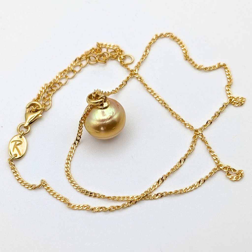 Gold vermeil necklace with an large south sea pearl pendant on a white background