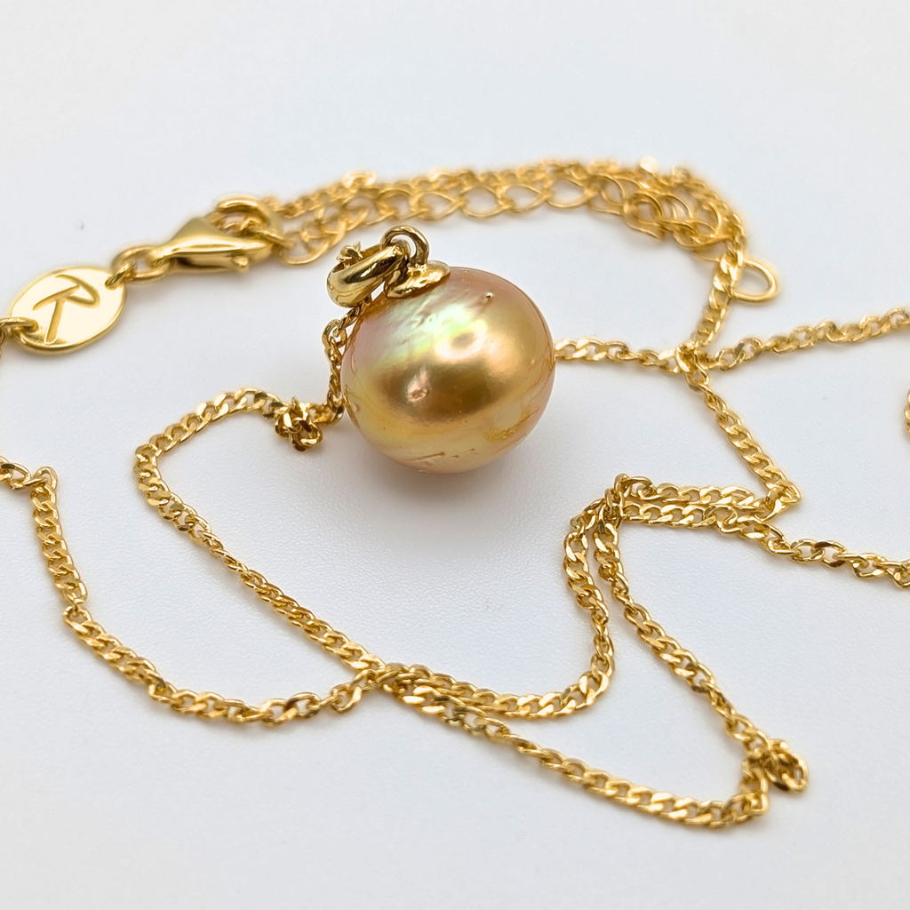 Gold vermeil necklace with an large south sea pearl pendant on a white background