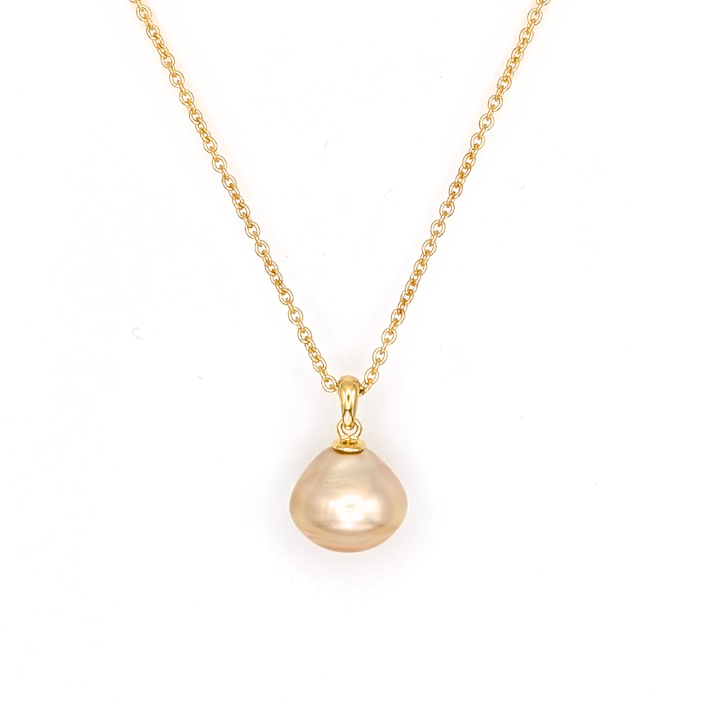 Large gold south sea pearl pendant with gold vermeil chain on a white 