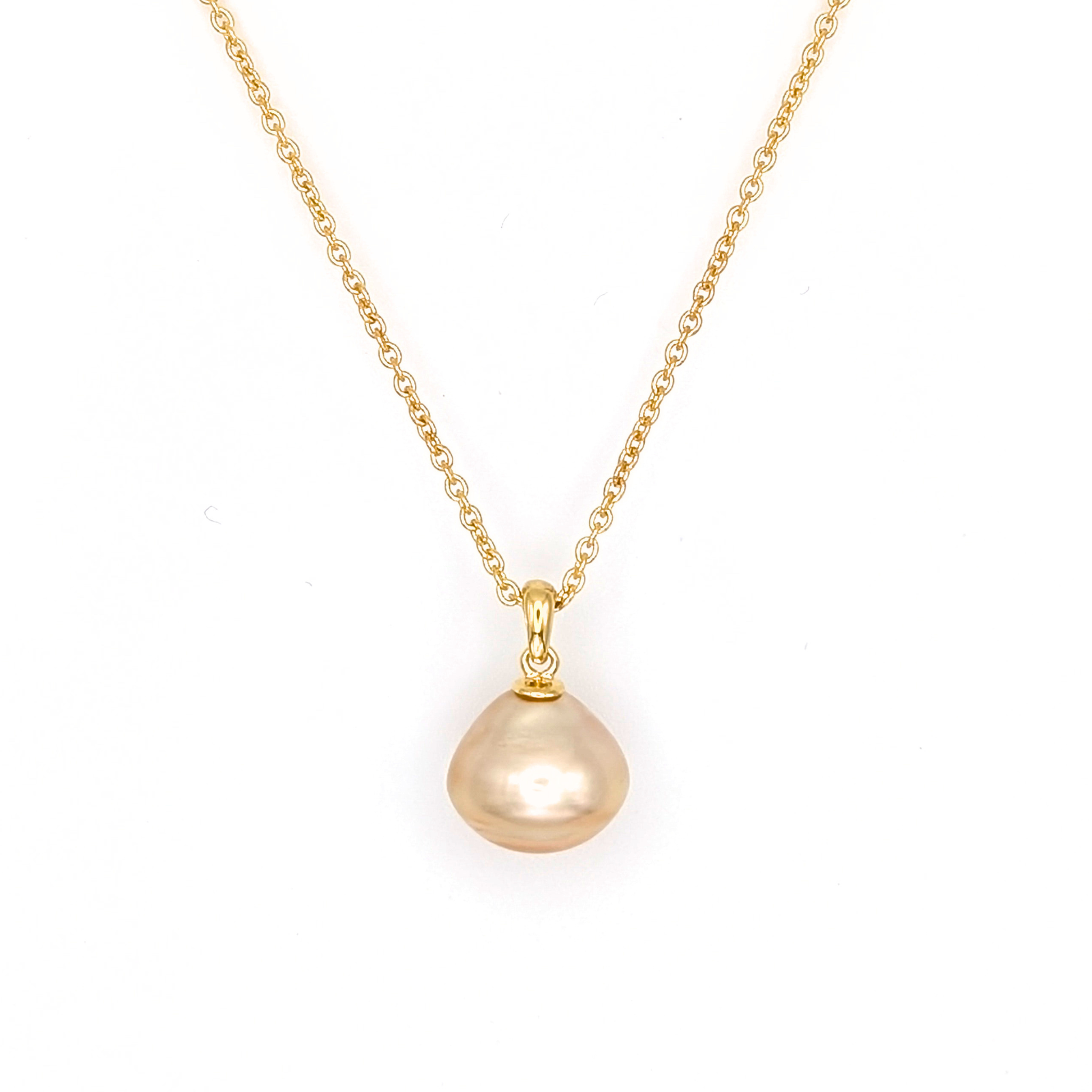 Large gold south sea pearl pendant with gold vermeil chain on a white 