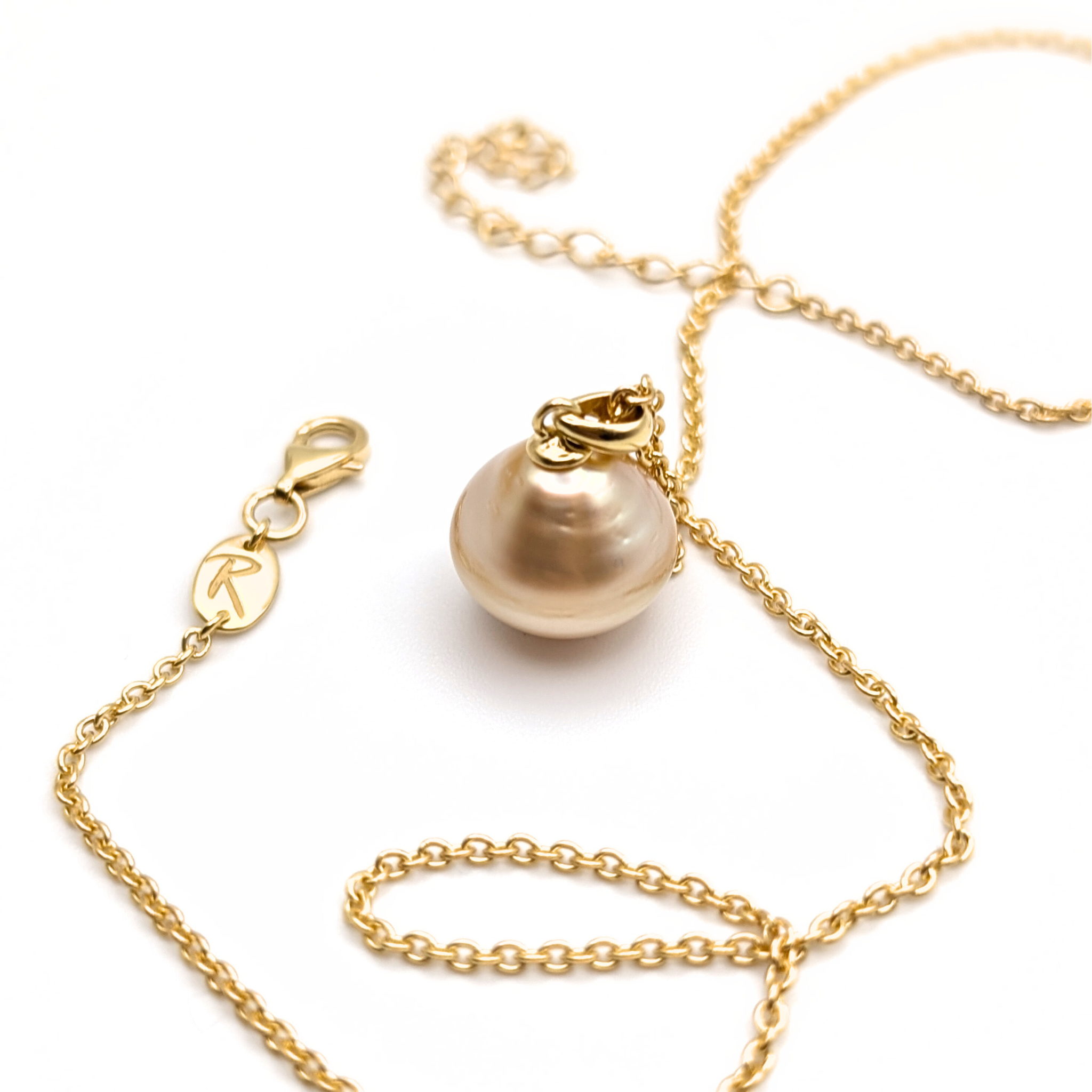 Large gold south sea pearl pendant with gold vermeil chain on a white 
