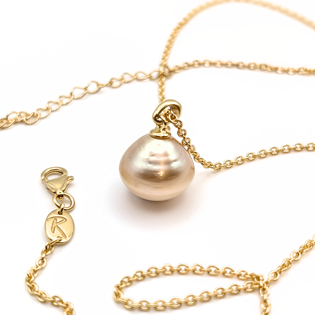 Large gold south sea pearl pendant with gold vermeil chain on a white 