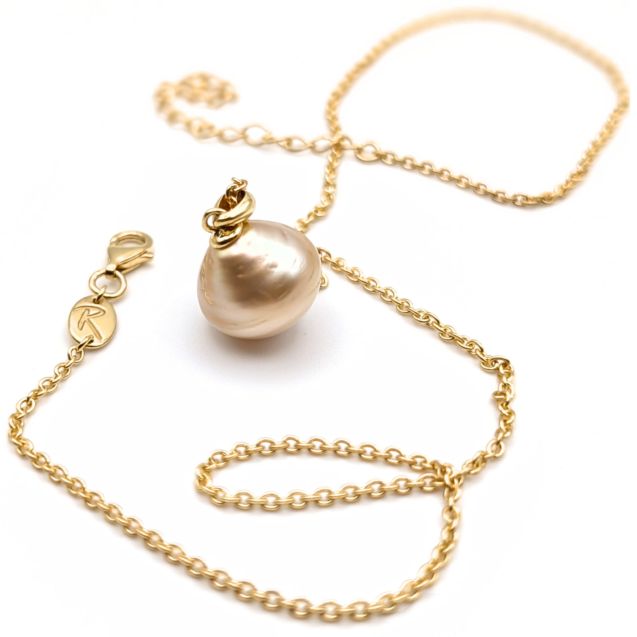 Large gold south sea pearl pendant with gold vermeil chain on a white 