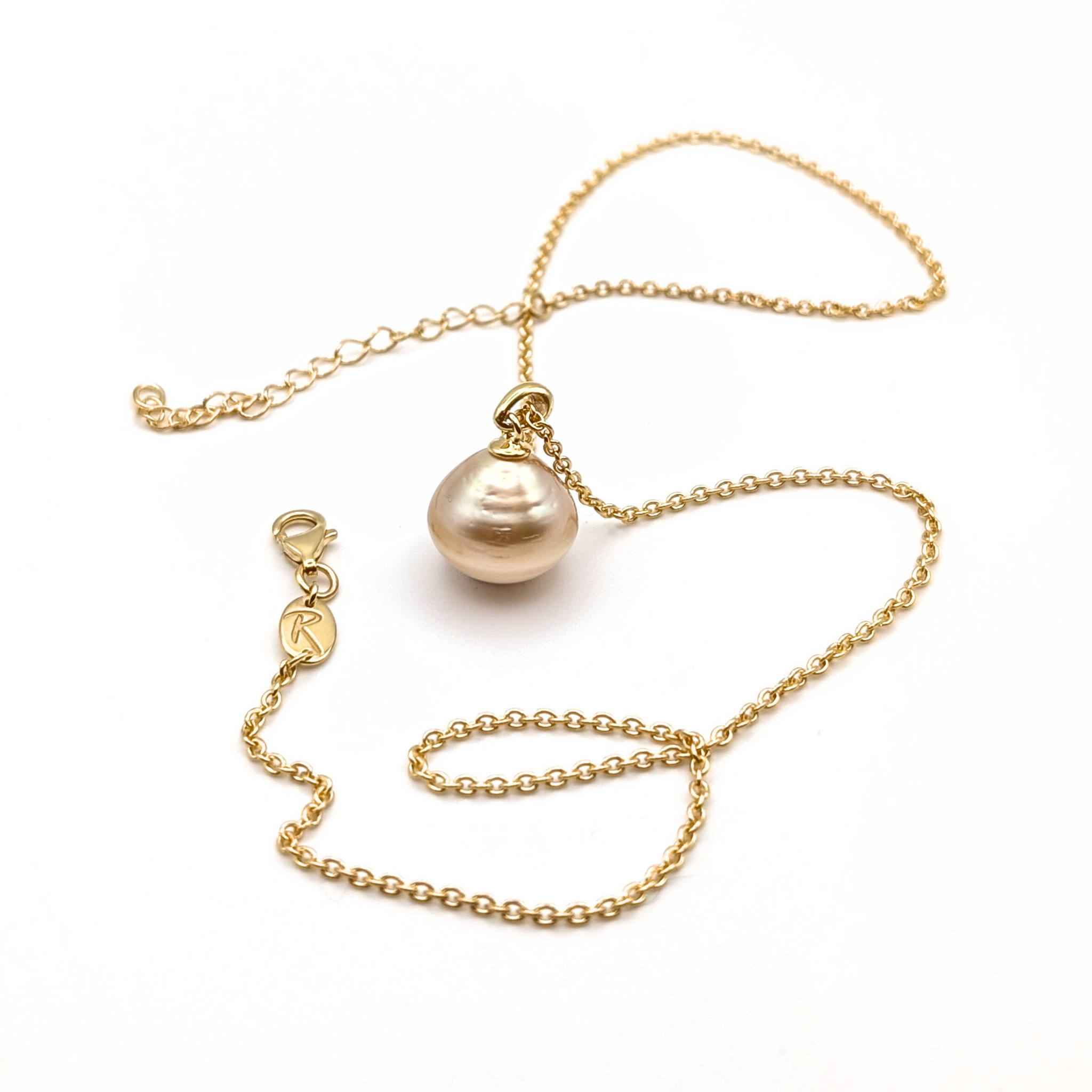 Large gold south sea pearl pendant with gold vermeil chain on a white 