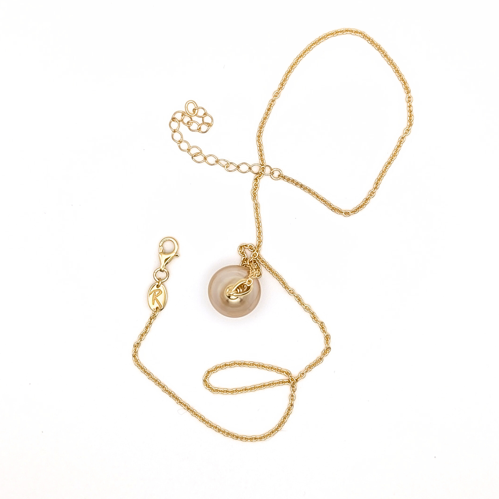 Large gold south sea pearl pendant with gold vermeil chain on a white background