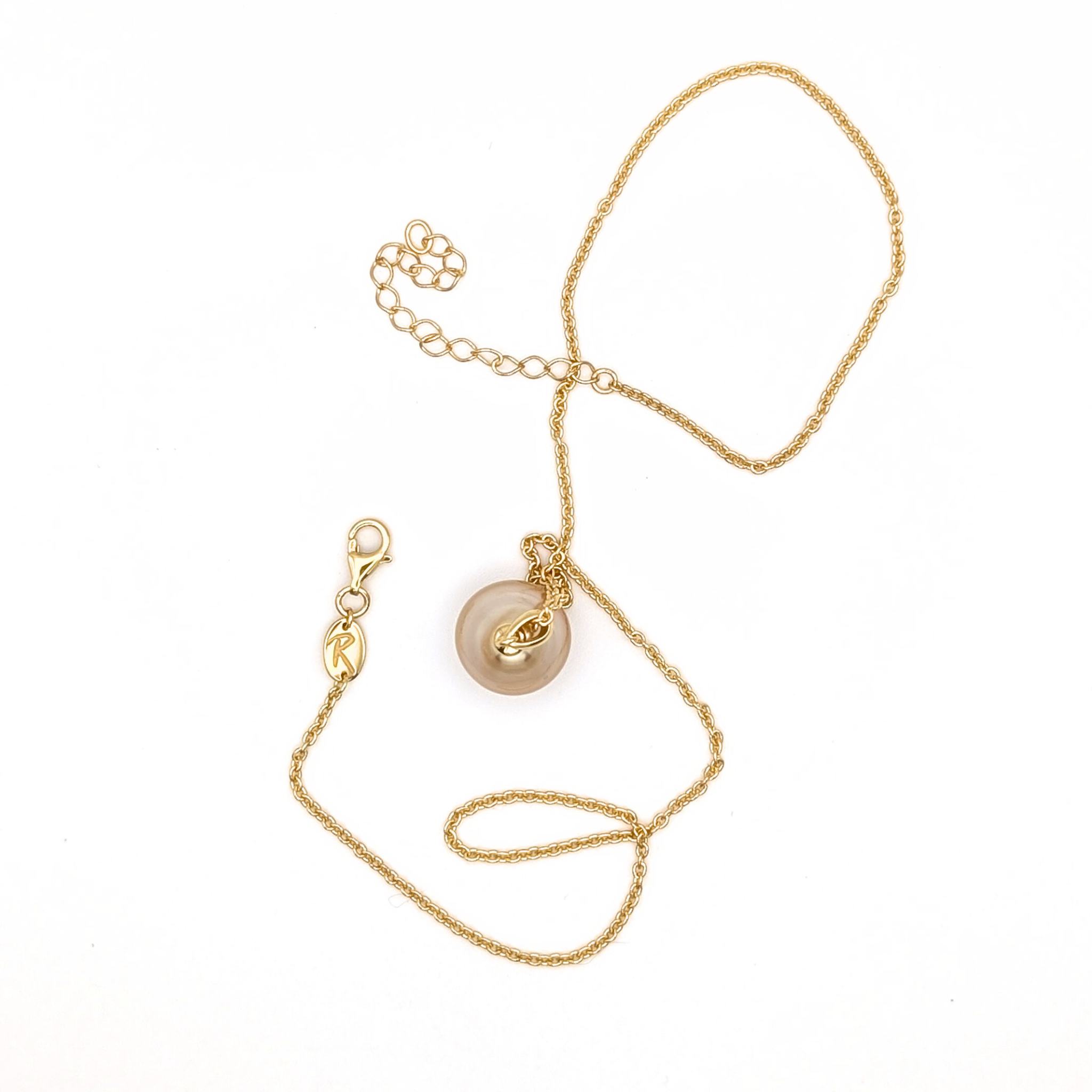 Large gold south sea pearl pendant with gold vermeil chain on a white background