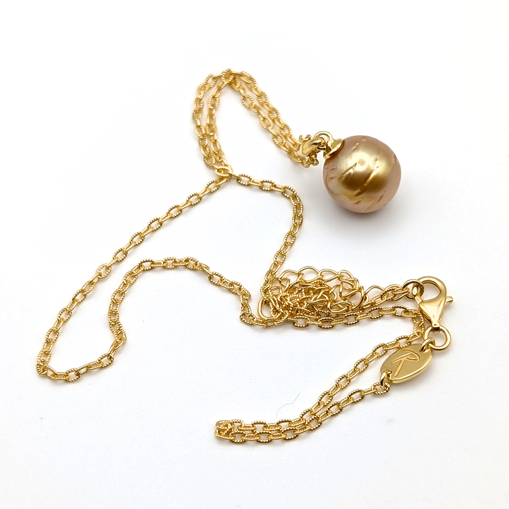 Gold striped south sea pearl pendant necklace with gold vermeil necklace on a white background