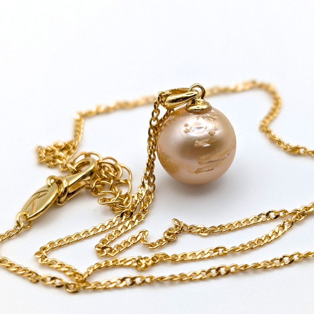 Gold vermeil necklace with a gold south sea pearl pendant on a white background