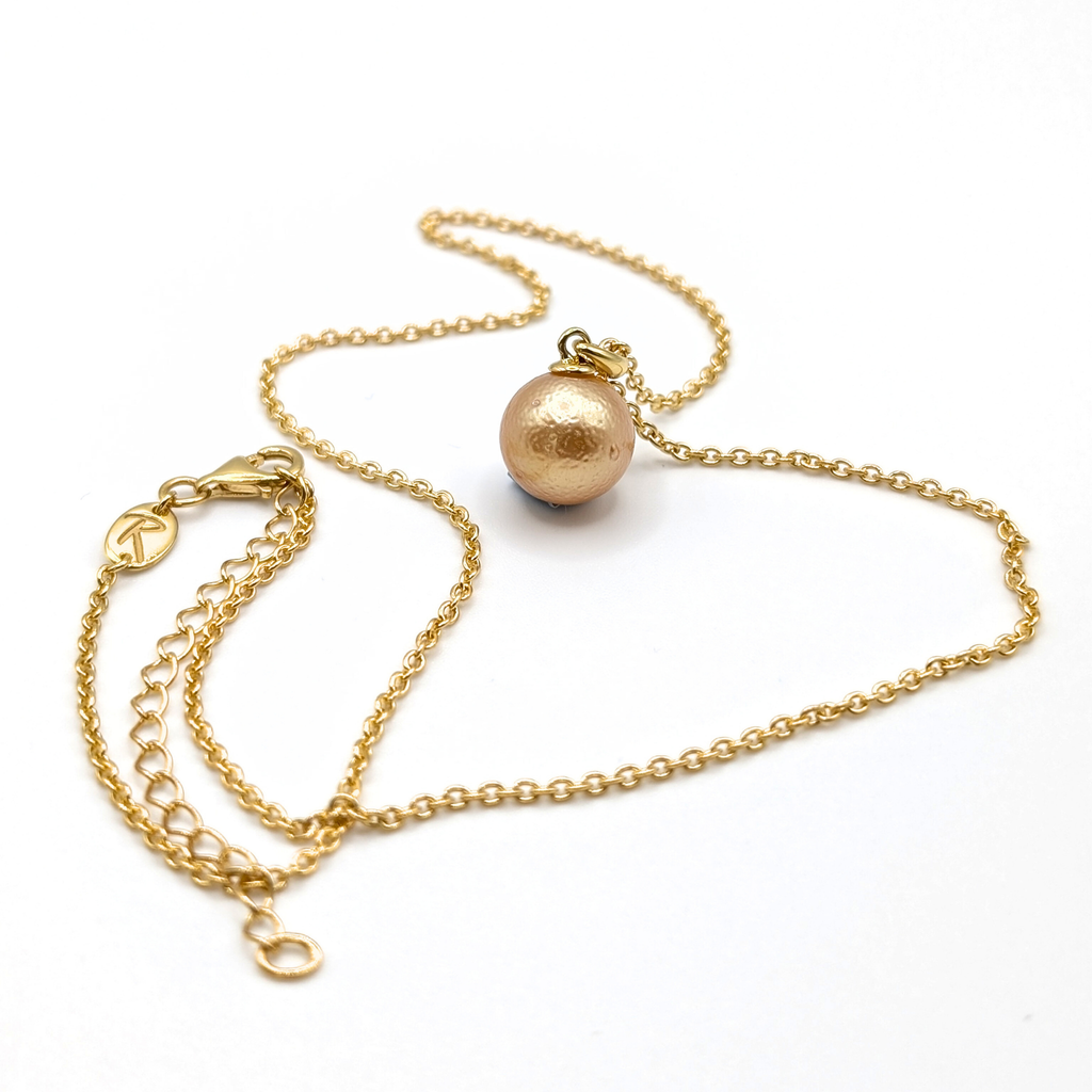 Gold South Sea pearl pendant necklace with Gold vermeil chain on a white background