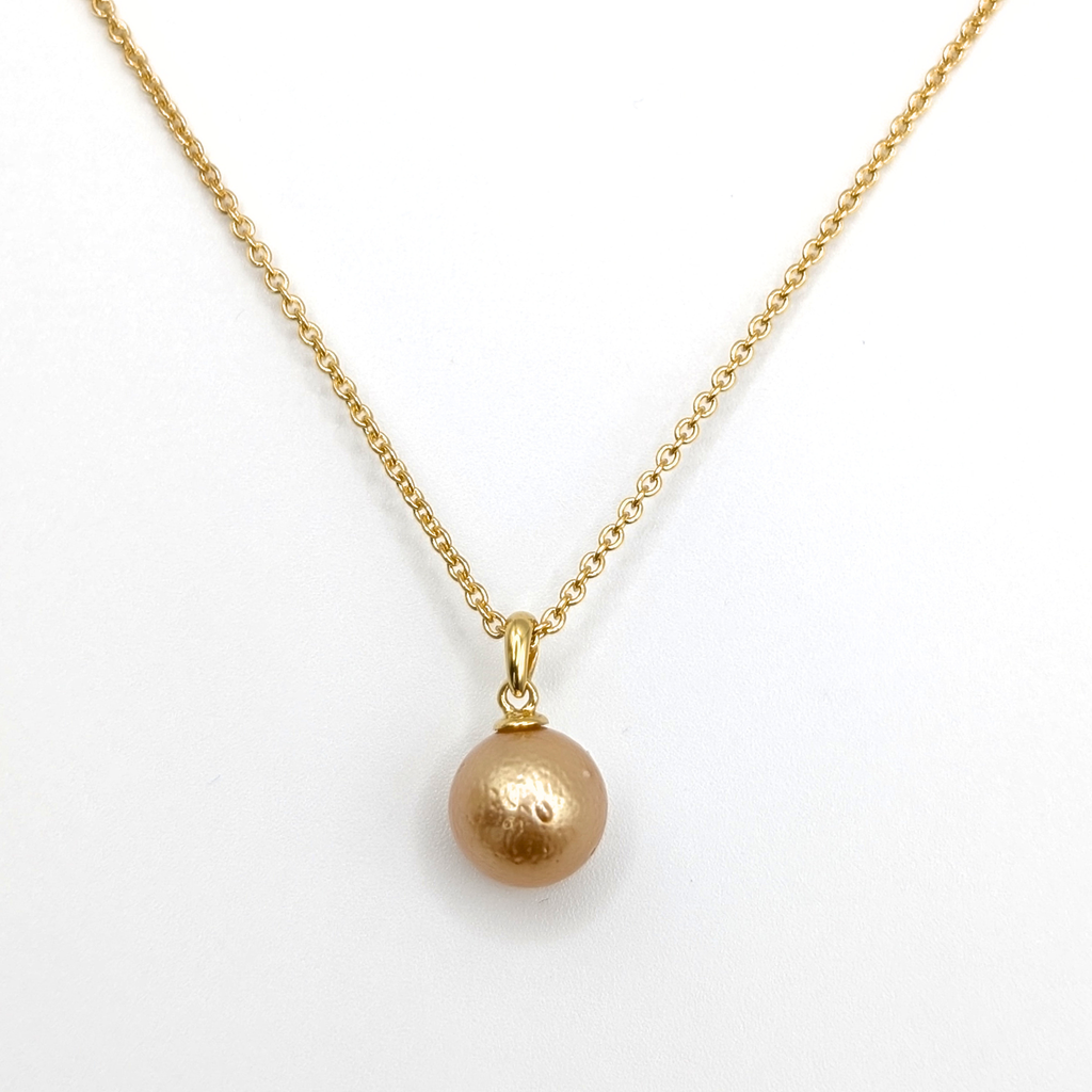 Gold South Sea pearl pendant necklace with Gold vermeil chain on a white background