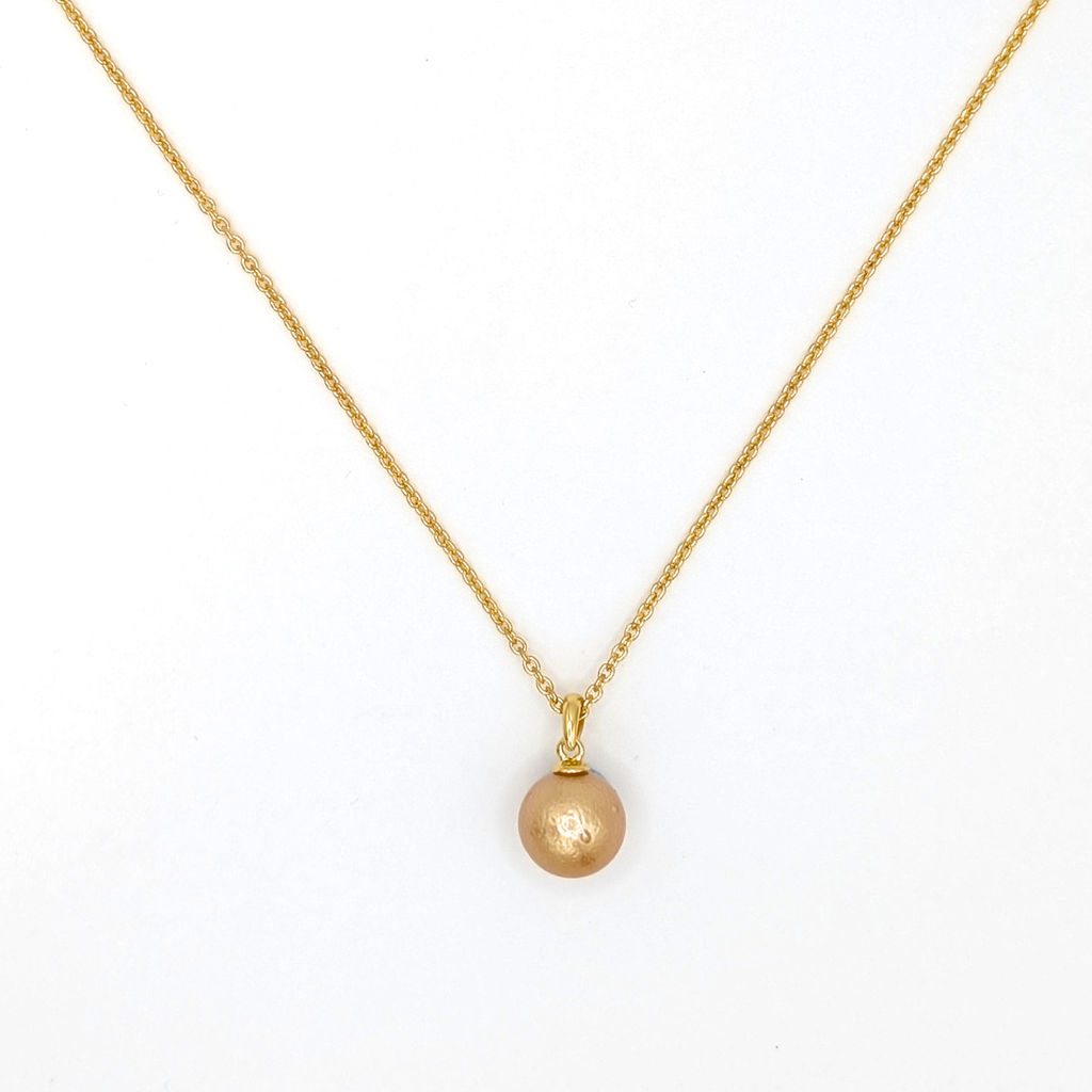 Gold South Sea pearl pendant necklace with Gold vermeil chain on a white background