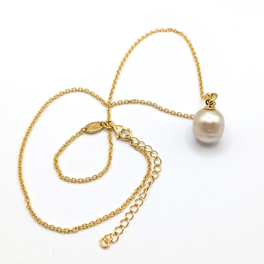 Gold south sea pearl pendant necklace with gold vermeil chain on a white background