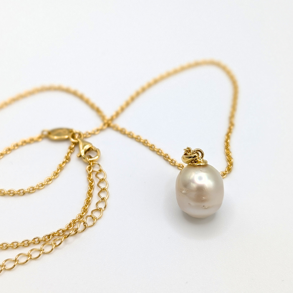 Gold south sea pearl pendant necklace with gold vermeil chain on a white background