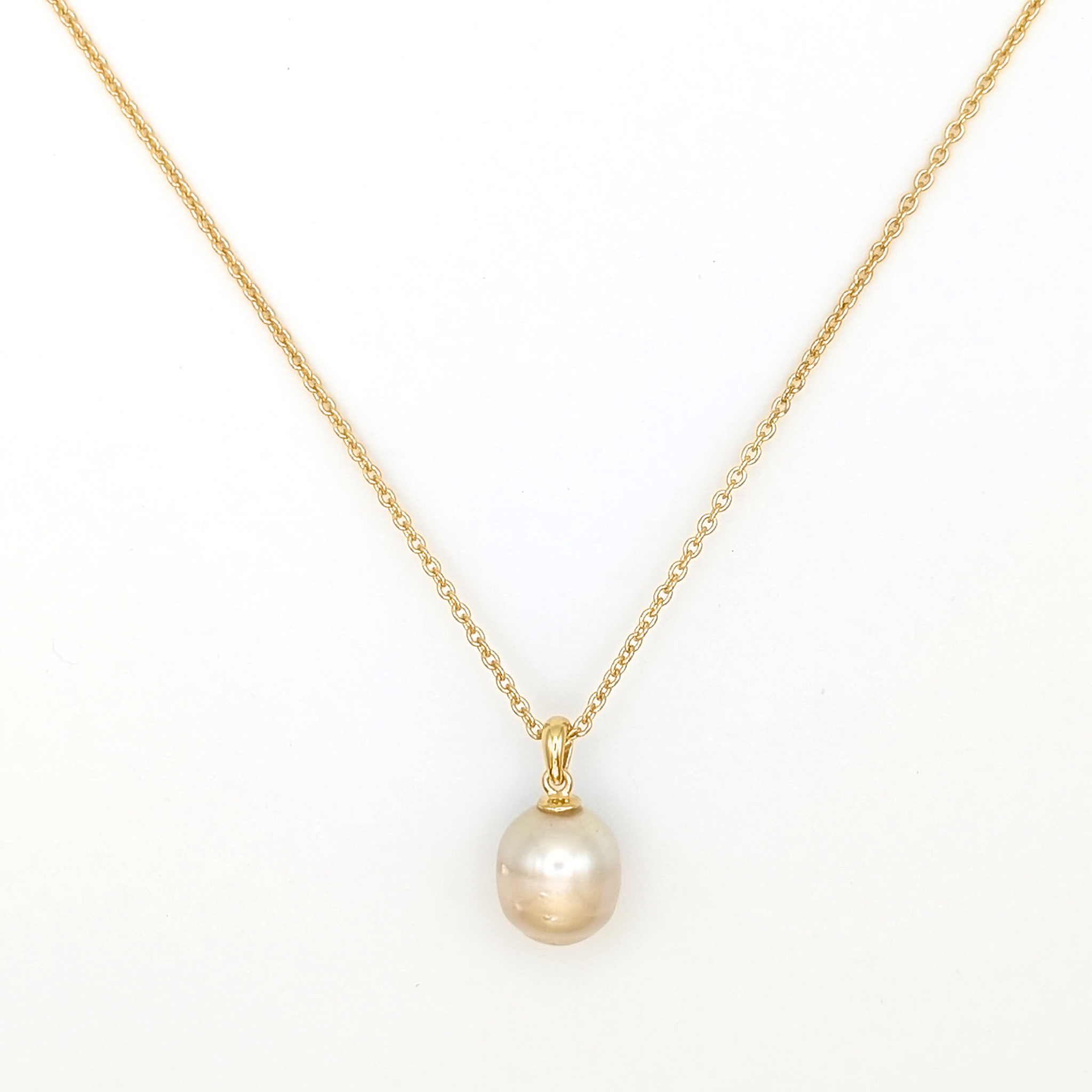 Gold south sea pearl pendant necklace with gold vermeil chain on a white background