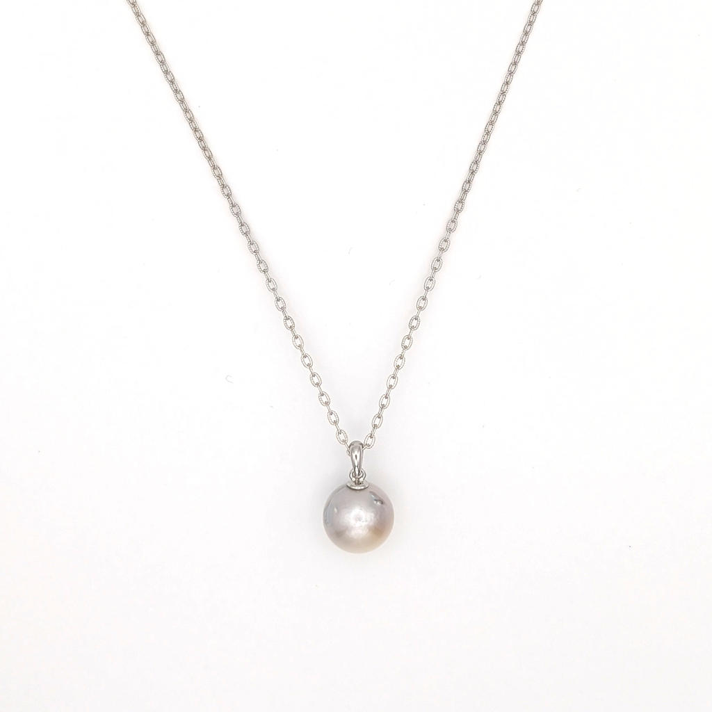Silver south sea pearl pendant necklace with rhodium plated silver chain on a white background
