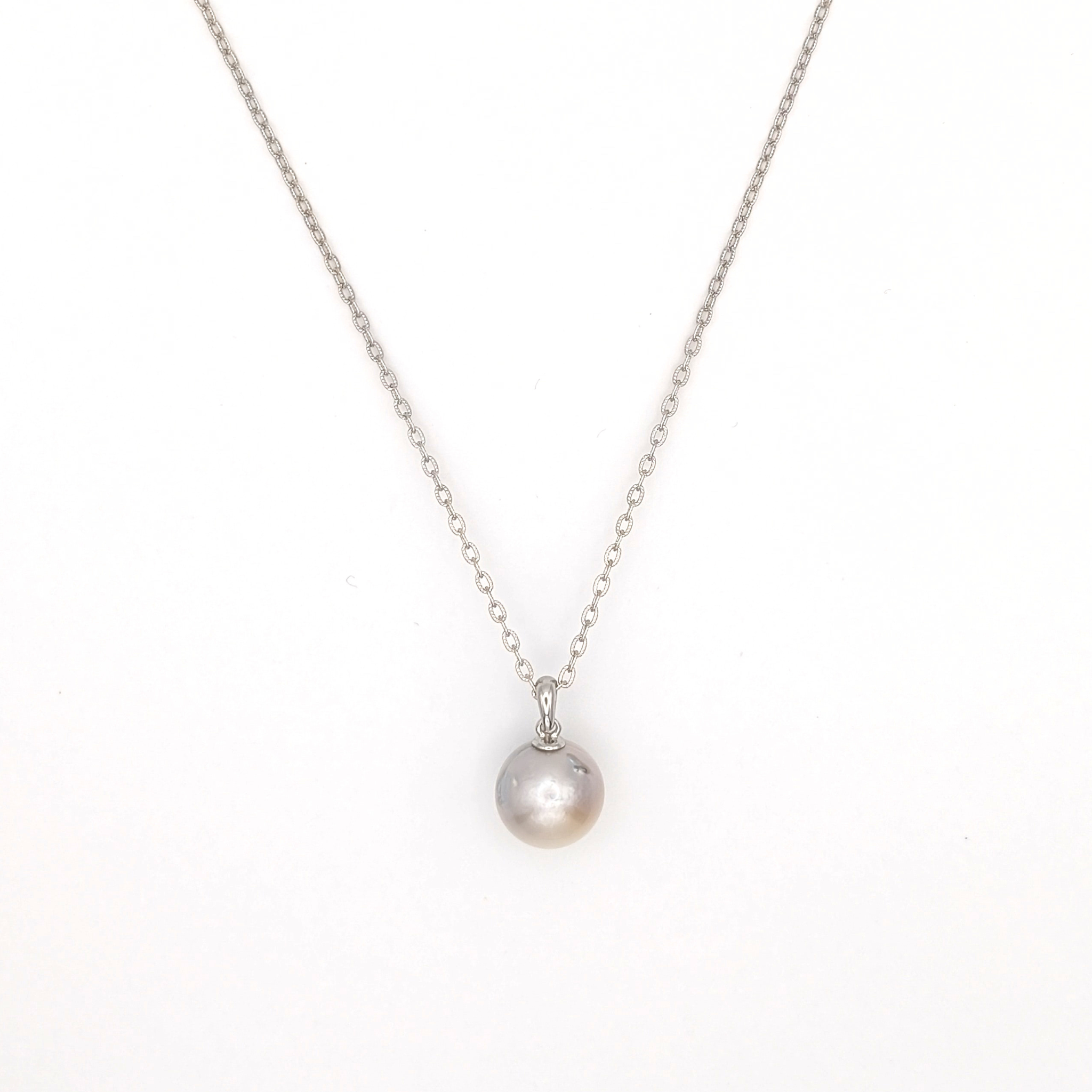 Silver south sea pearl pendant necklace with rhodium plated silver chain on a white background