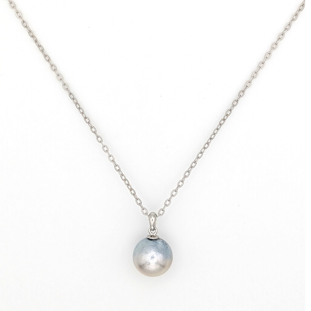 Necklace with a single silver south sea  pearl pendant on rhodium plated chain with a white background