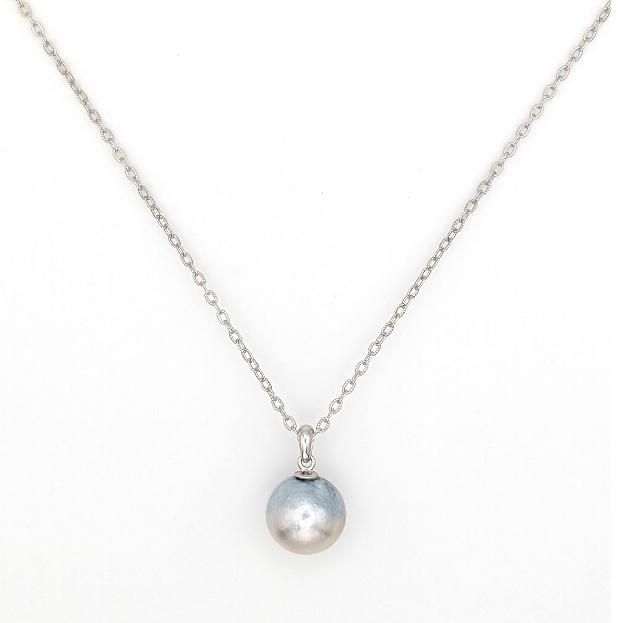 Necklace with a single silver south sea  pearl pendant on rhodium plated chain with a white background