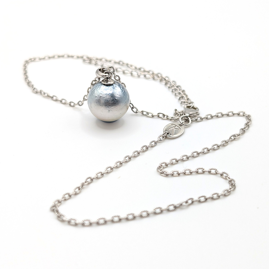 Necklace with a single silver south sea  pearl pendant on rhodium plated chain with a white background