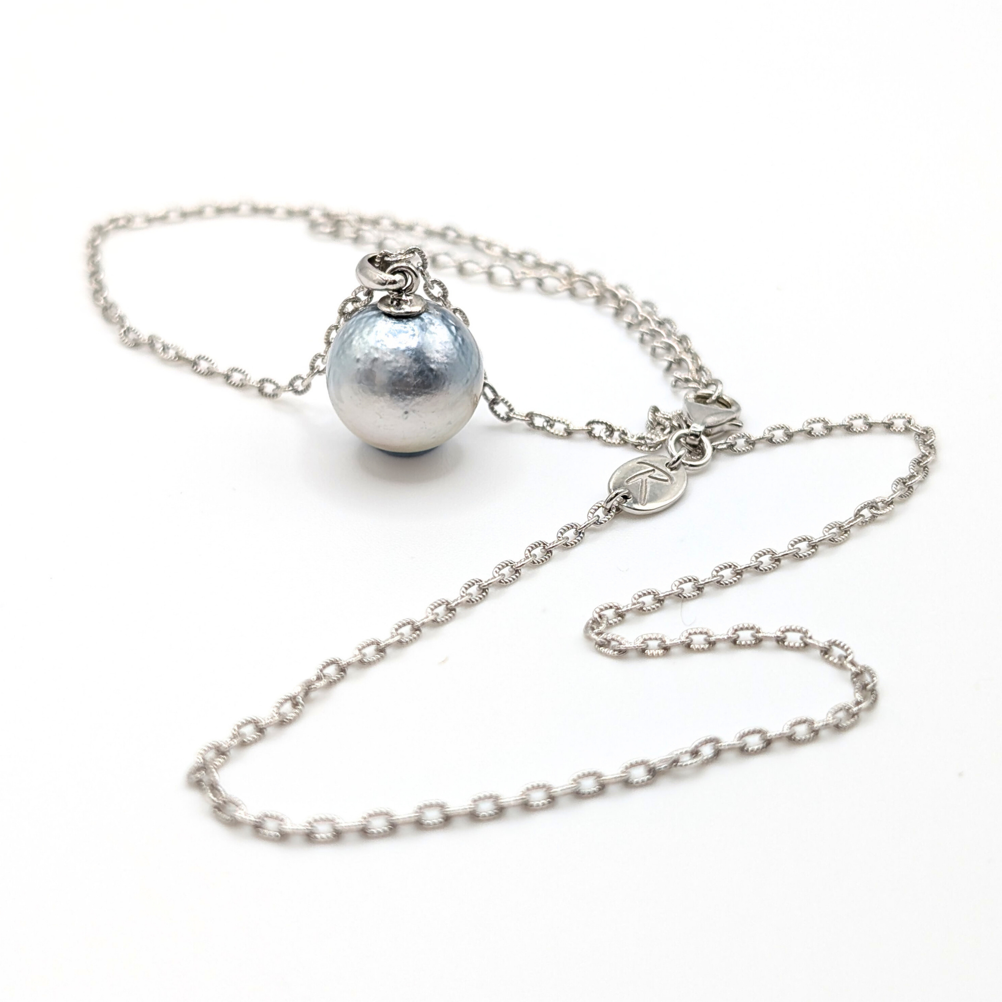 Necklace with a single silver south sea  pearl pendant on rhodium plated chain with a white background