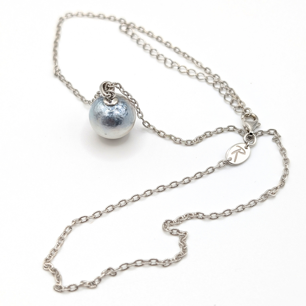 Necklace with a single silver south sea  pearl pendant on rhodium plated chain with a white background