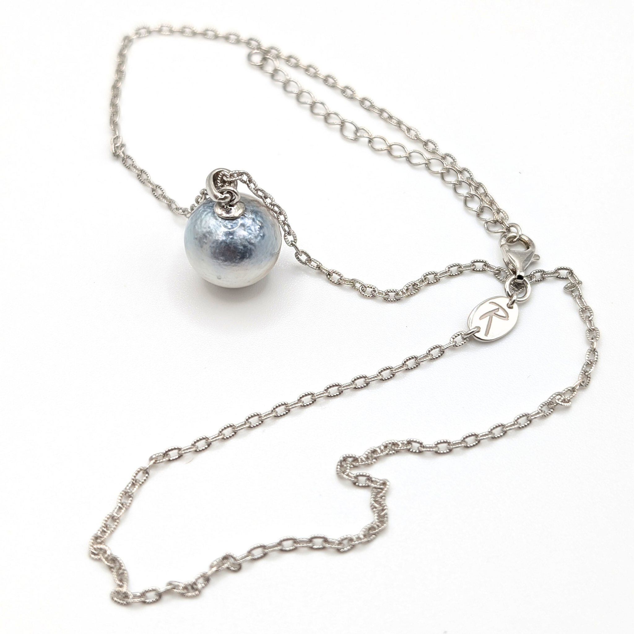 Necklace with a single silver south sea  pearl pendant on rhodium plated chain with a white background