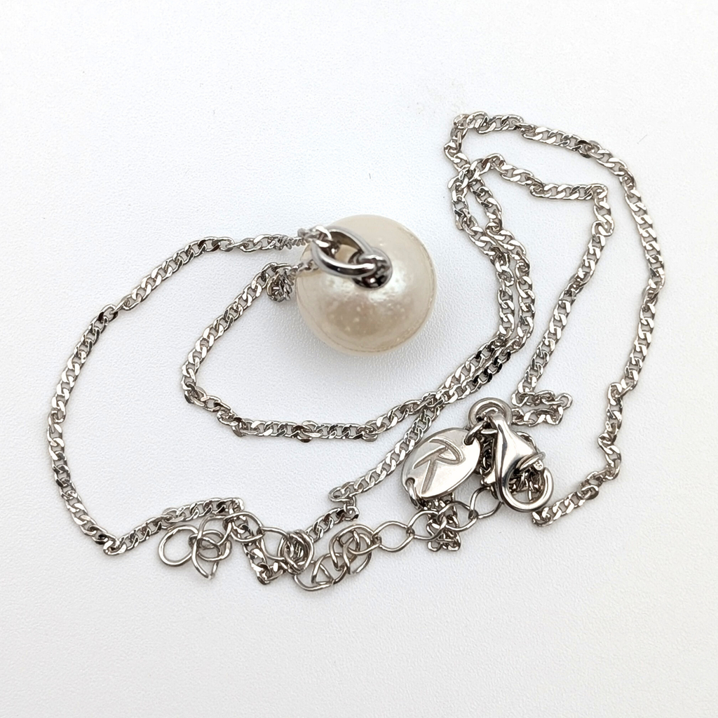 Rhodium plated sterling Silver necklace with a south sea  pearl pendant on a white background