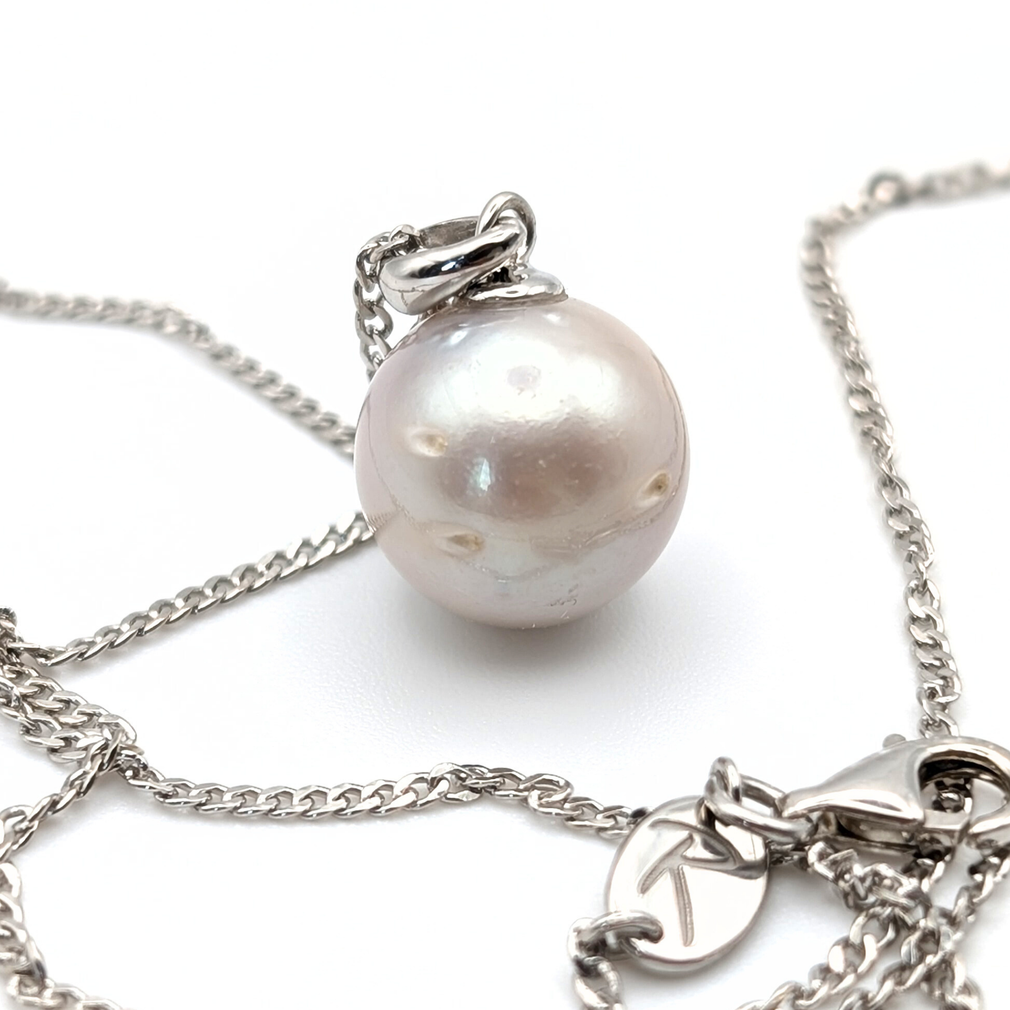 South Sea Pearl Pendant necklace with  Rhodium plated sterling silver chain on a white background