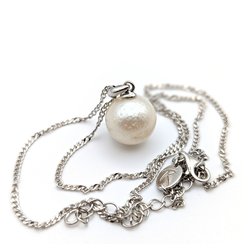 Rhodium plated sterling Silver necklace with a south sea  pearl pendant on a white background