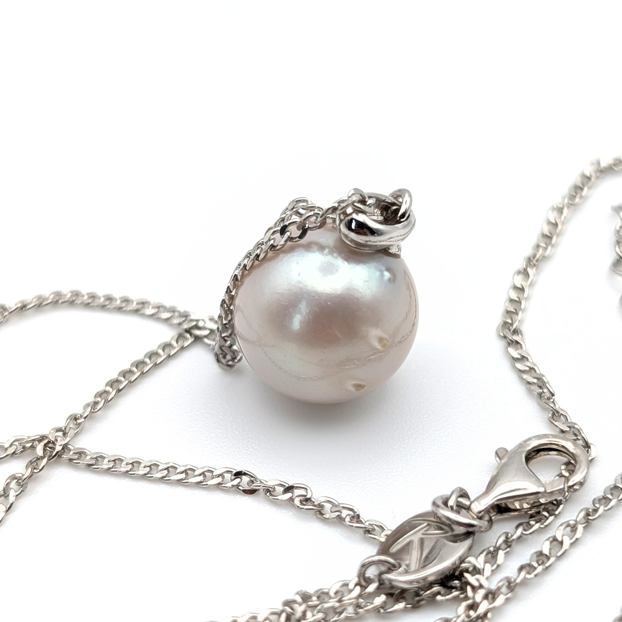 South Sea Pearl Pendant necklace with  Rhodium plated sterling silver chain on a white background
