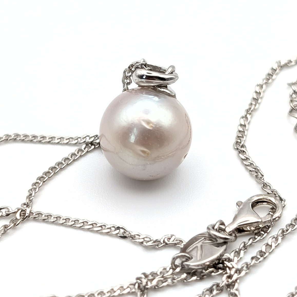 South Sea Pearl Pendant necklace with  Rhodium plated sterling silver chain on a white background