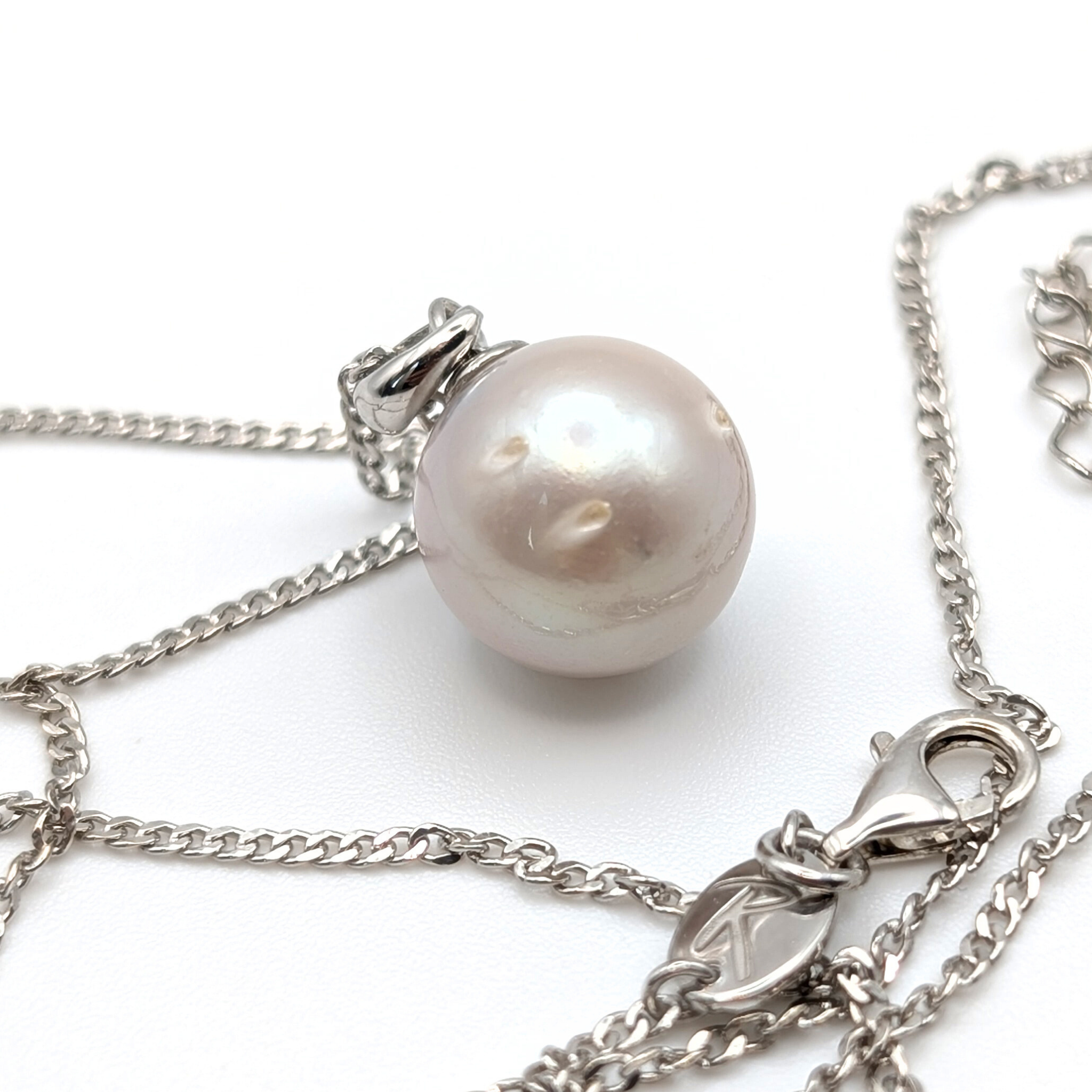 South Sea Pearl Pendant necklace with  Rhodium plated sterling silver chain on a white background