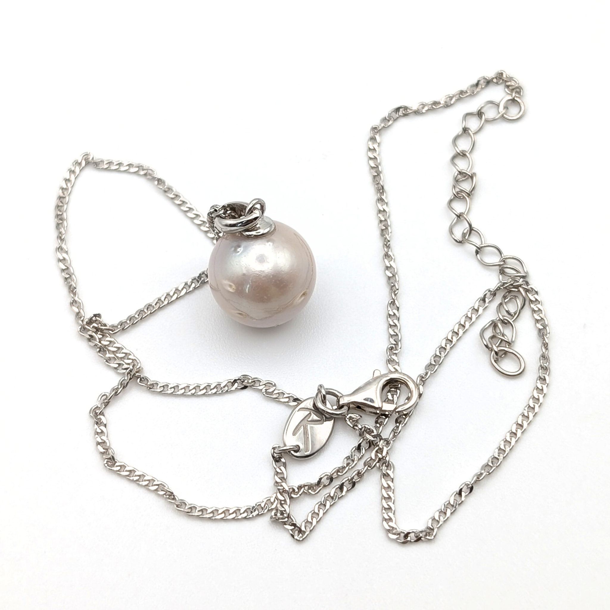 South Sea Pearl Pendant necklace with  Rhodium plated sterling silver chain on a white background