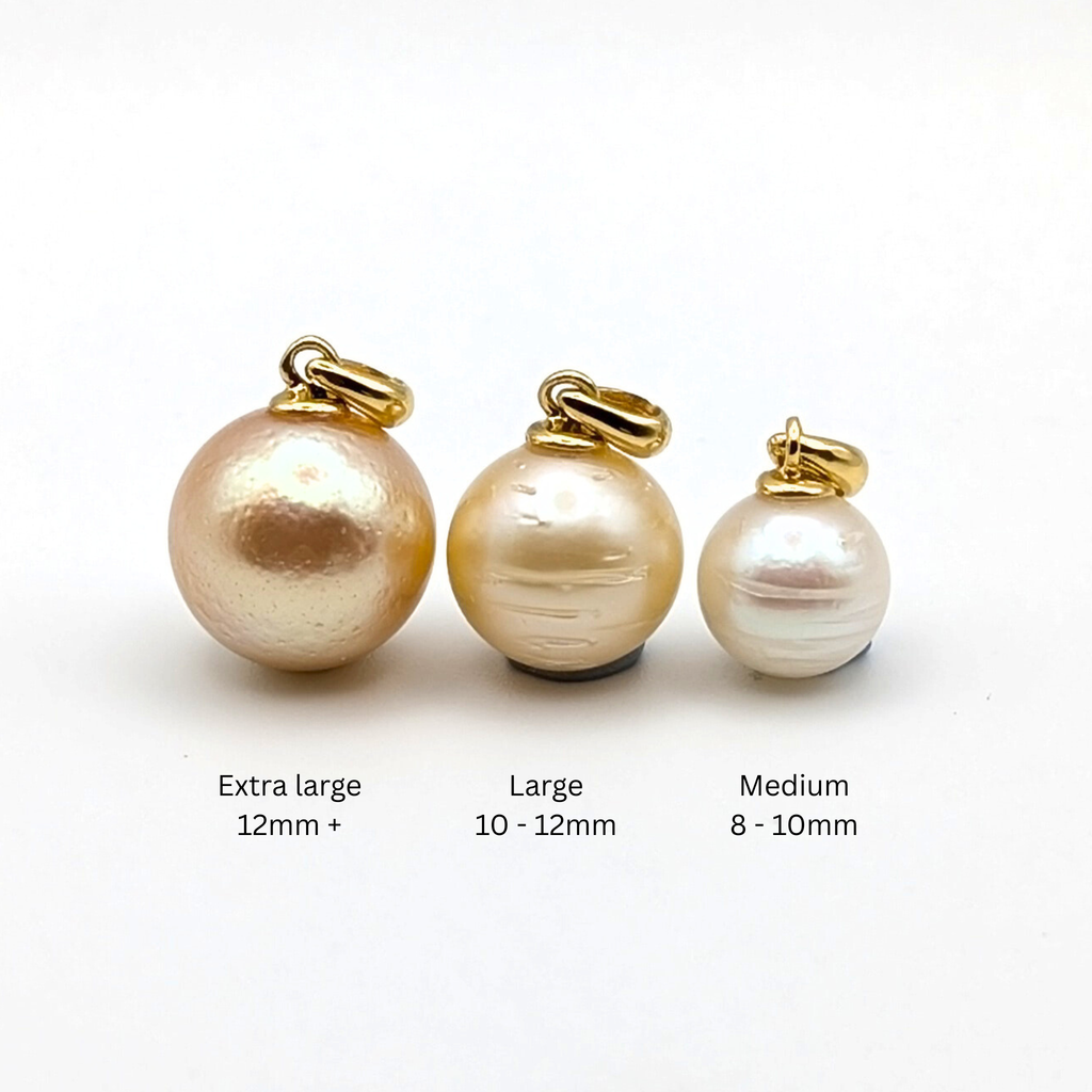 Three South Sea pearl pendants with gold bails labelled 'Extra large', 'Large', and 'Medium' on a white background.