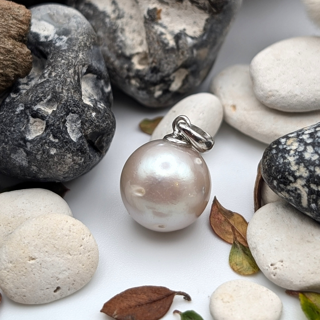 South Sea Pearl Pendant necklace with  Rhodium plated sterling silver chain on a white background