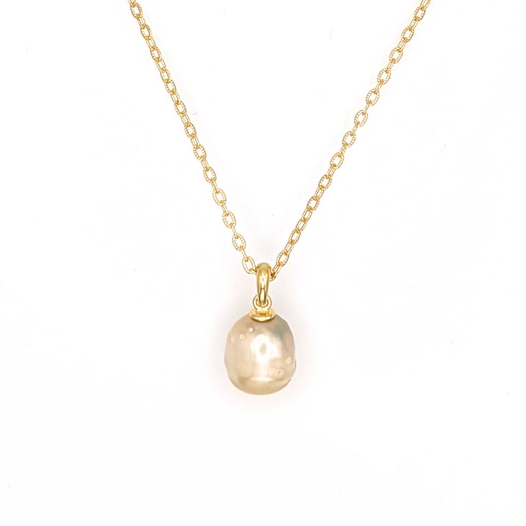 Gold vermeil pendant necklace with a gold spotted south sea pearl pendant on a white background