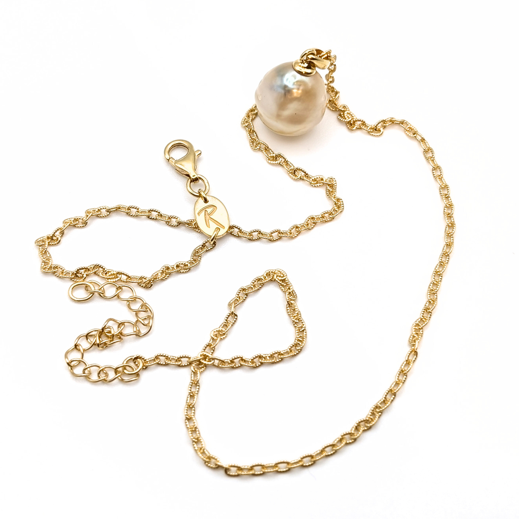 Gold vermeil pendant necklace with a gold spotted south sea pearl pendant on a white background