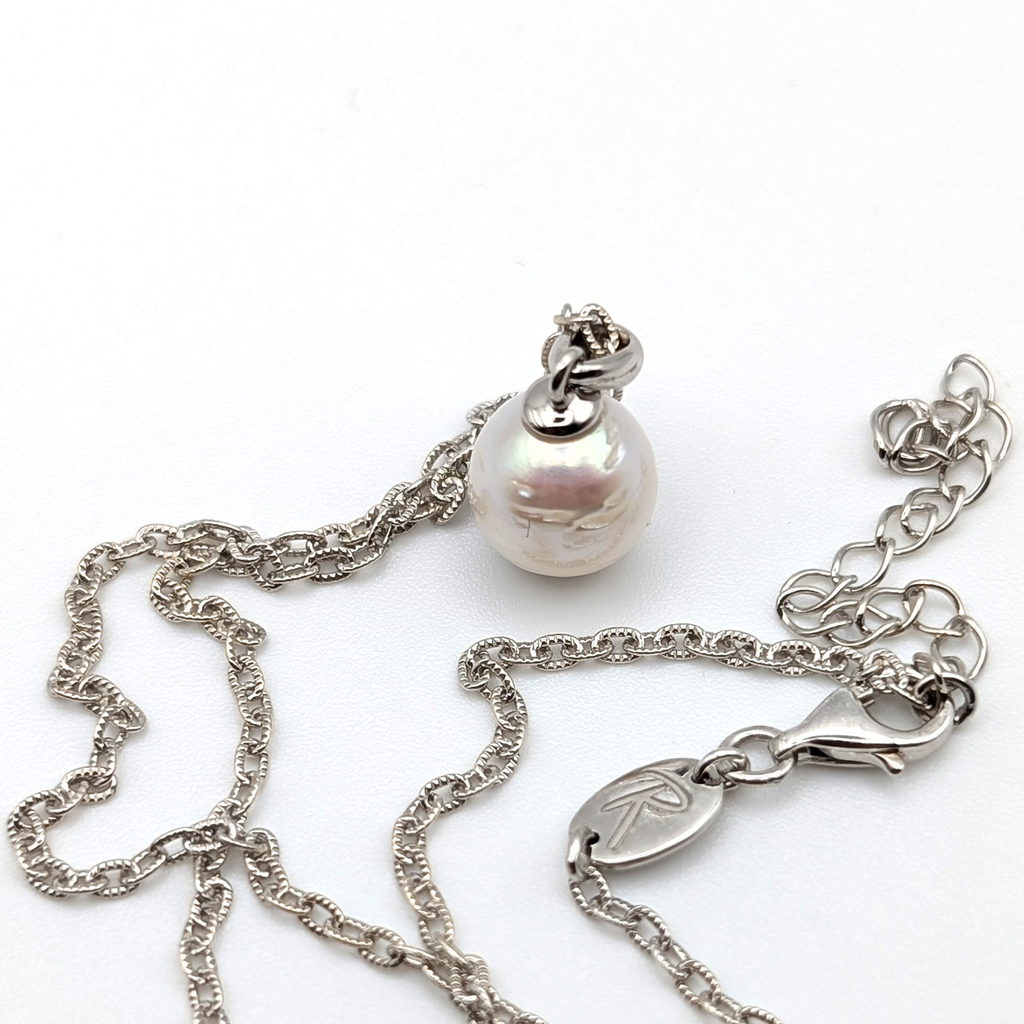 Striped medium silver white south sea pearl with three spots pendant necklace with rhodium plated sterling silver chain on white background