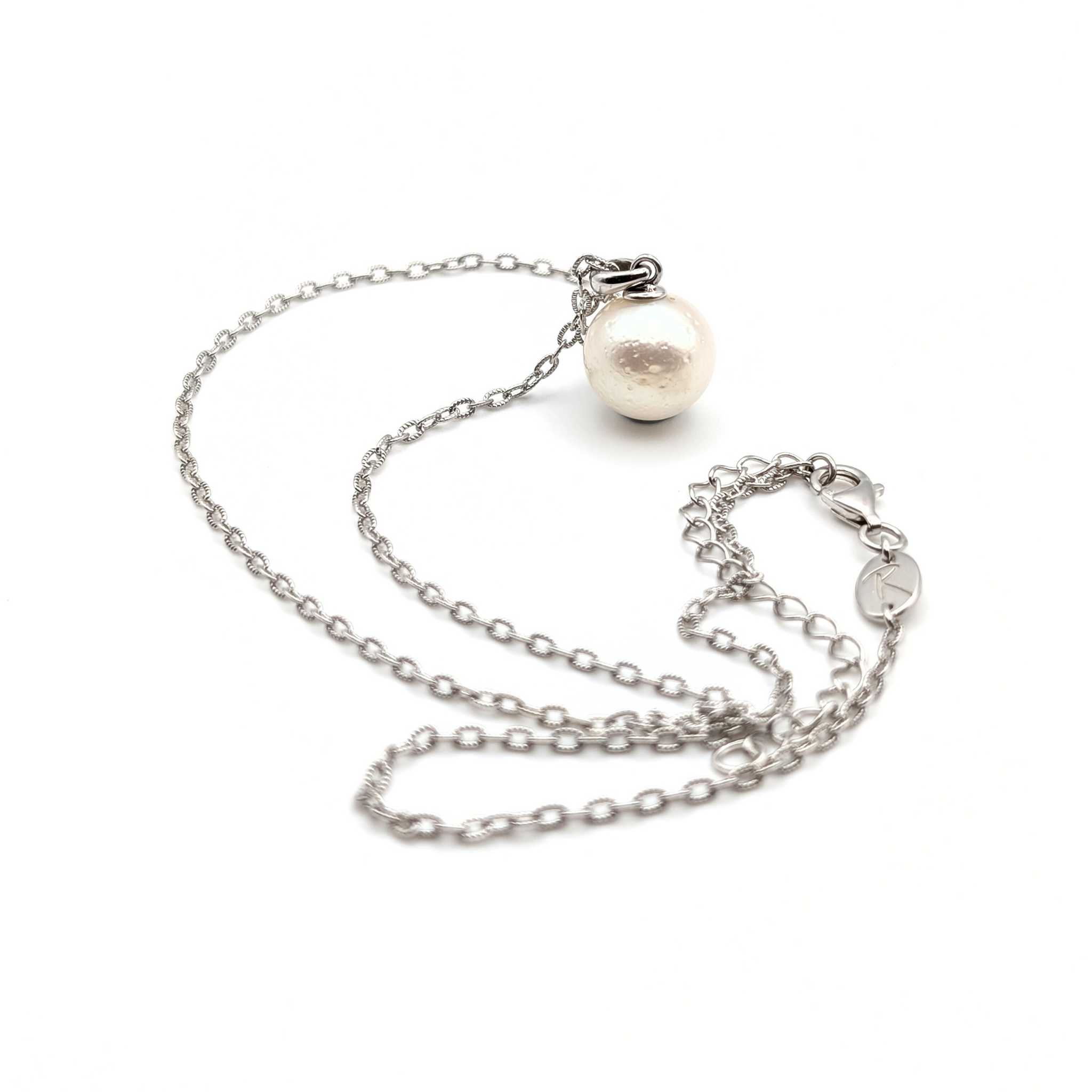 large white south sea pearl pendant necklace on a thin rhodium plated chain against a white background