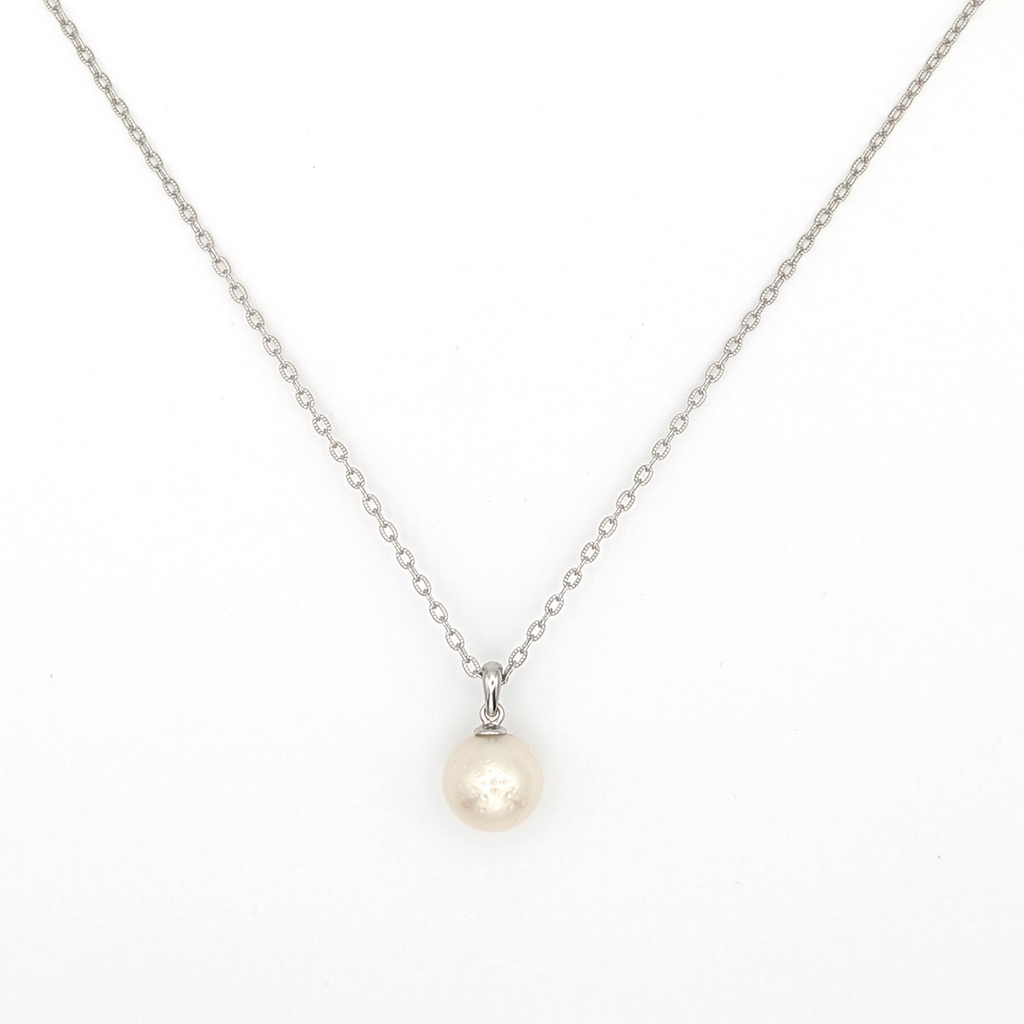 large white south sea pearl pendant necklace on a thin rhodium plated chain against a white background