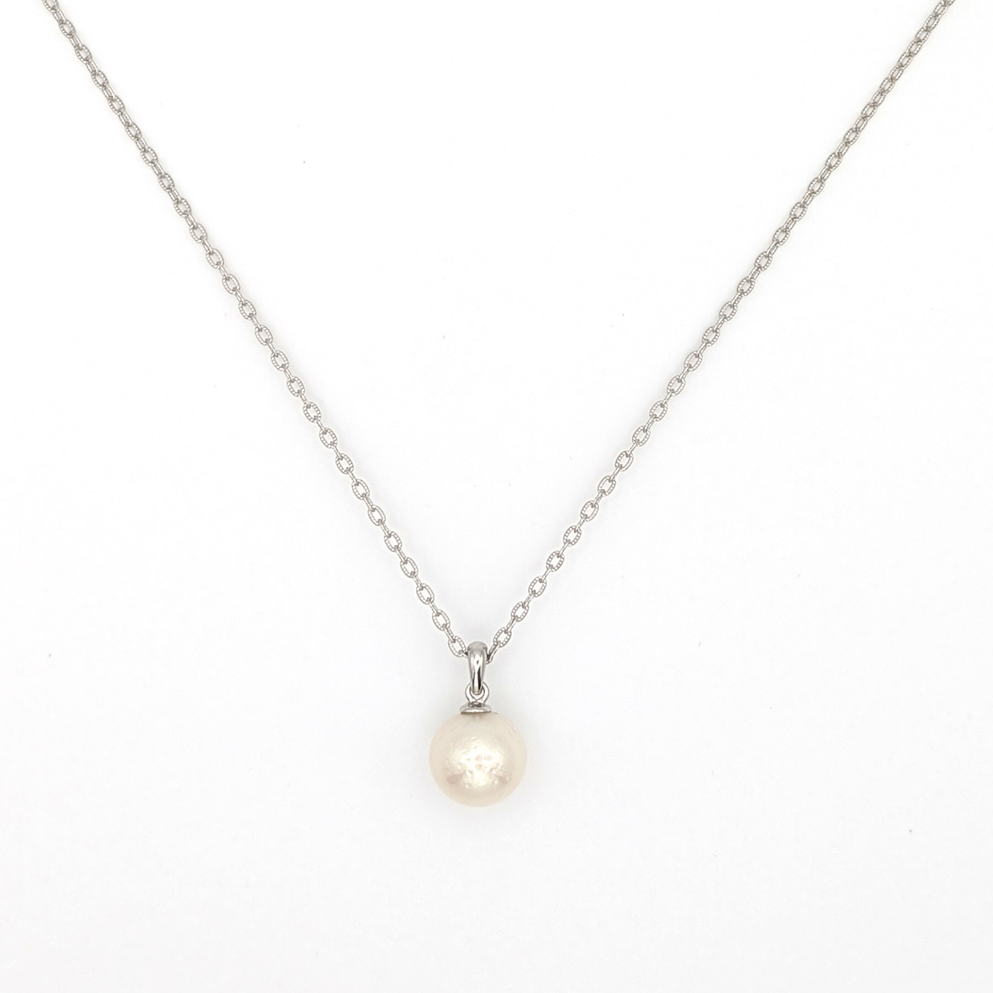 large white south sea pearl pendant necklace on a thin rhodium plated chain against a white background