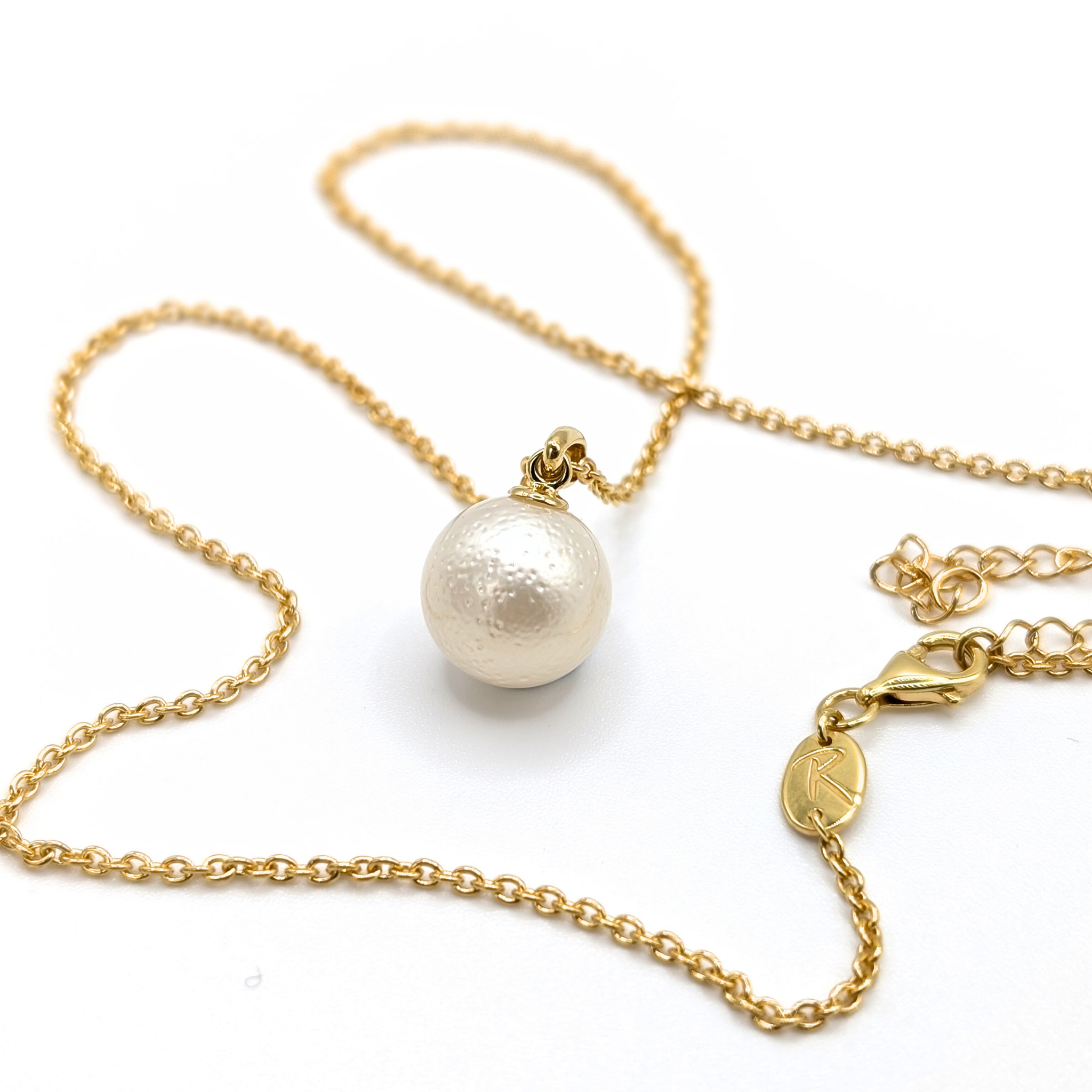 White south sea pearl pendant necklace with gold vermeil chain on white background